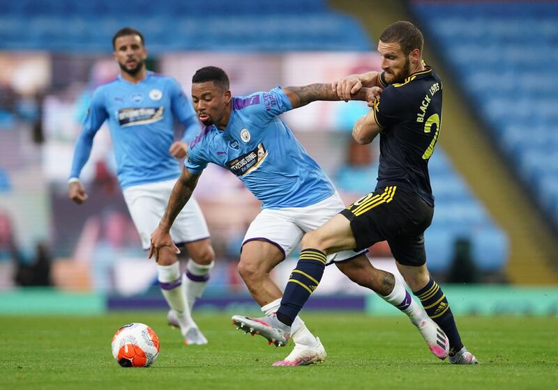 Manchester City's Gabriel Jesus in action with Arsenal's Shkodran Mustafi. Reuters