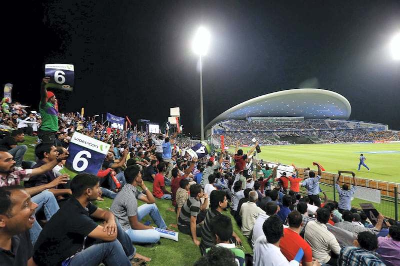 Fans watch Australia and Pakistan lock horns at Zayed Cricket Stadium in Abu Dhabi. Pawan Singh / The National