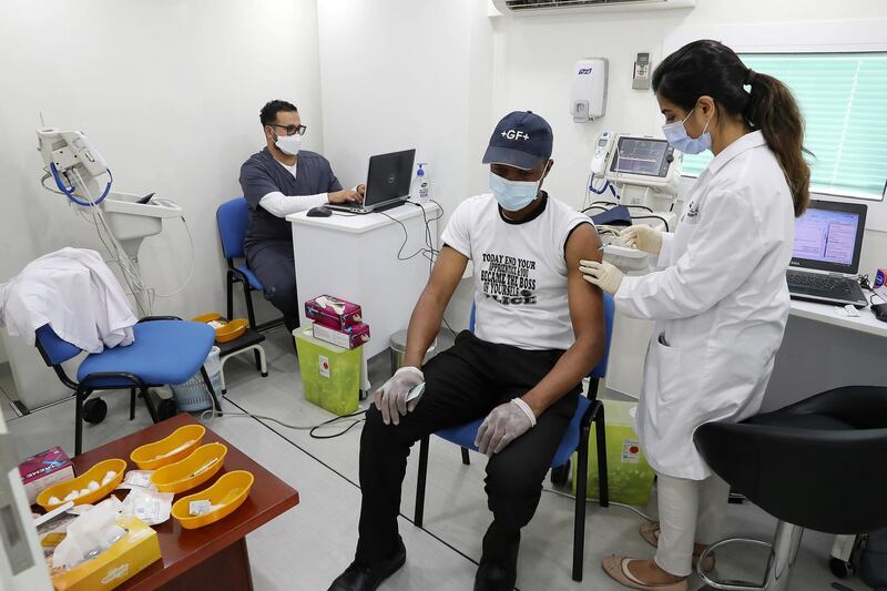 DUBAI, UNITED ARAB EMIRATES , March 11, 2021 – People getting their Covid vaccine at the  MBRU a community mobile health clinic near the Al Waha Community on Nad Al Hamar Road in Dubai. (Pawan Singh / The National) For News/Online/Instagram. Story by Nick Webster