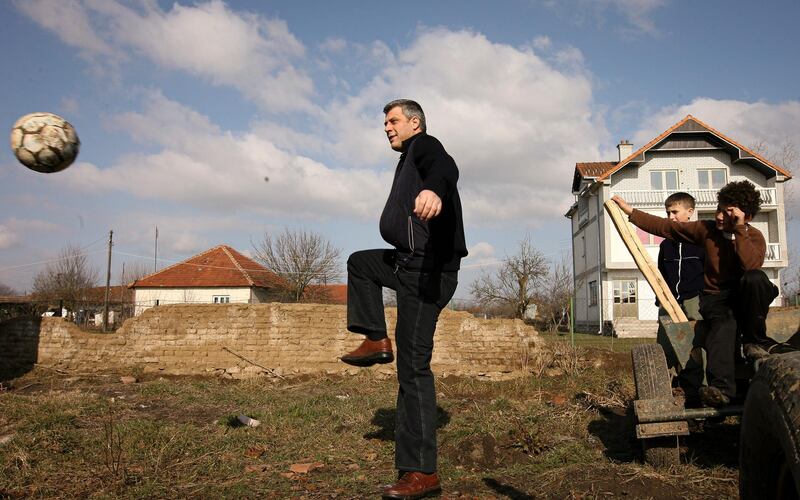 A file picture of President of the Republic of Kosovo Hashim Thaci playing with ethnic Serb children in the village of Rubovc, Kosovo, 10 February 2008. Mr Thaci has been charged with a range of crimes against humanity and war crimes, including murder, enforced disappearance of persons, persecution, and torture. Valdrin XHemaj / EPA