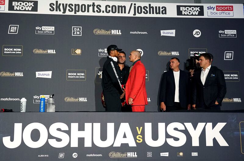 Anthony Joshua and Oleksandr Usyk face off. PA