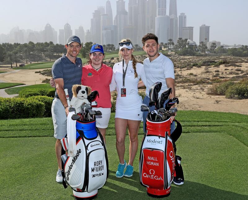 Niall Horan, right, with Rory McIlroy, left, Paige Spiranac, centre right, and Saoirse Lambe of Ireland (centre left) who won a global competition to play with them during the pro-am before the Omega Dubai Desert Classic on the Majlis Course at Emirates Golf Club. David Cannon / Getty Images