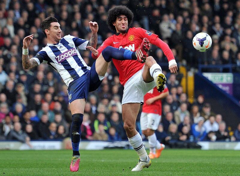 Centre midfield: Marouane Fellaini, Manchester United. Produced his most assured performance in a United shirt as he ran the midfield against West Brom. Paul Ellis / AFP