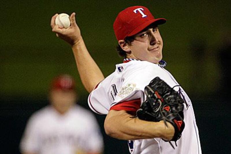 Derek Holland, the Texas Rangers pitcher, shut out St Louis Cardinals to help tie the World Series after Game 4.