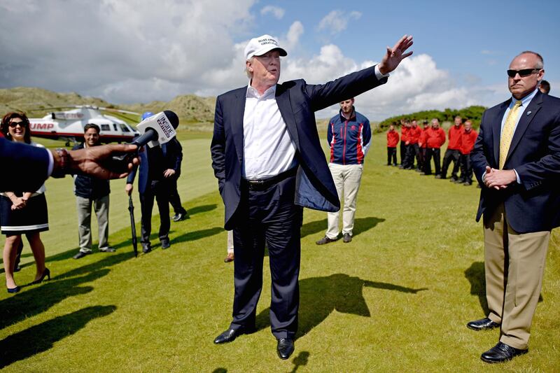 ABERDEEN, SCOTLAND - JUNE 25:  Presumptive Republican nominee for US president Donald Trump arrives at Trump International Golf Links on June 25, 2016 in Aberdeen, Scotland. The US presidential hopeful was in Scotland for the reopening of the refurbished Open venue golf resort Trump Turnberry which has undergone an eight month refurbishment as part of an investment thought to be worth in the region of two hundred million pounds.  (Photo by Jeff J Mitchell/Getty Images)