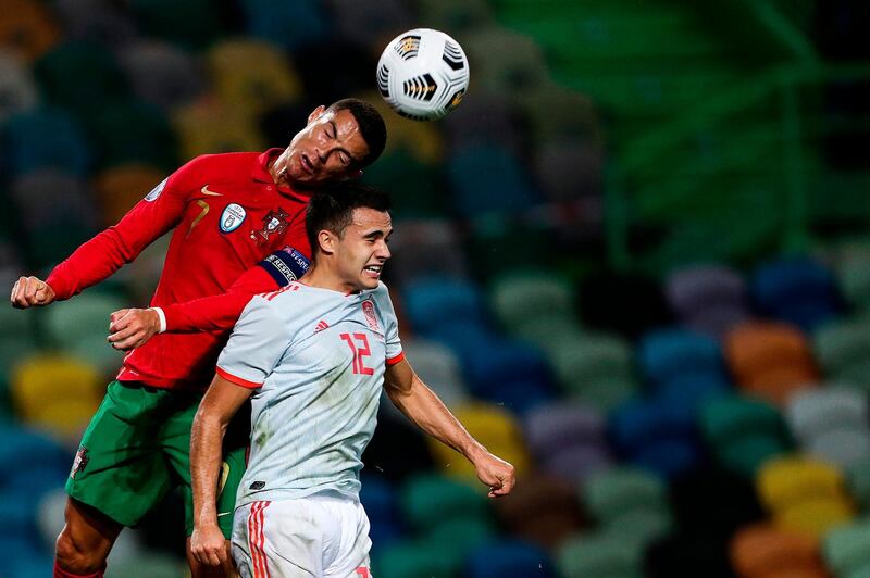 Portugal's forward Cristiano Ronaldo (L) vies with Spain's defender Sergio Reguilon during the friendly match between Portugal and Spain in Lisbon. AFP