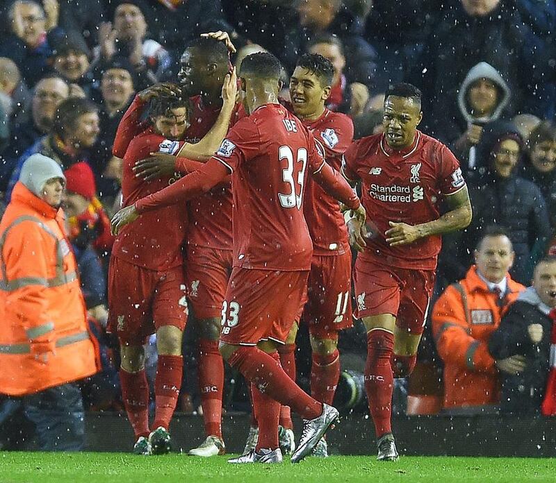 Liverpool’s Joe Allen (L) is congratulated by his teammates after scoring the 3-3 equalizer during the English Premier League soccer match between Liverpool FC and Arsenal FC at Anfield in Liverpool, Britain, 13 January 2016. The match ended 3-3.  EPA/PETER POWELL