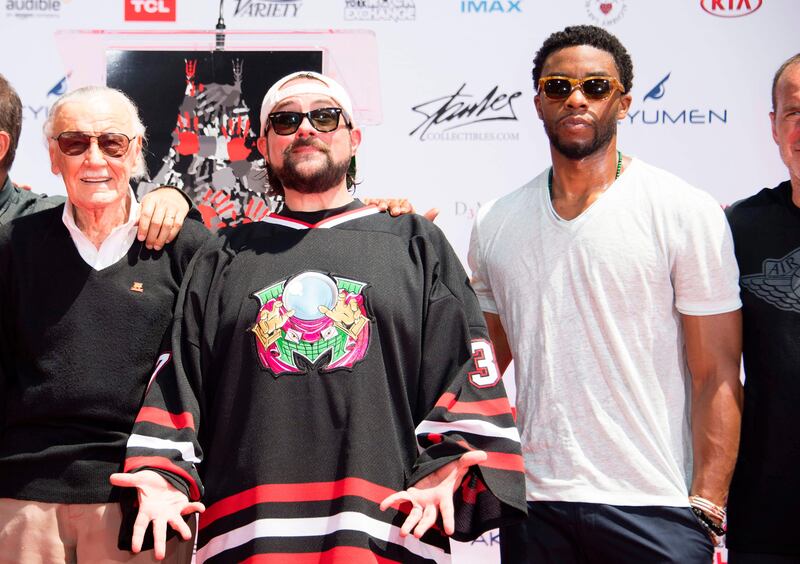 From left: Comic-book writer, editor, and publisher Stan Lee, and actors Kevin Smith and Chadwick Boseman attend Lee's hand and footprint ceremony at the TCL Chinese Theatre. Valerie Macon / AFP