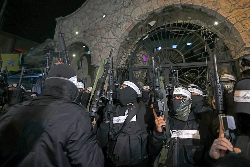 Al Aqsa Martyrs' Brigade militants during a rally in the Balata refugee camp. AFP