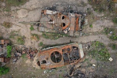 A destroyed Russian tank and armoured vehicle beside the road in Irpin, near Kyiv. Getty Images