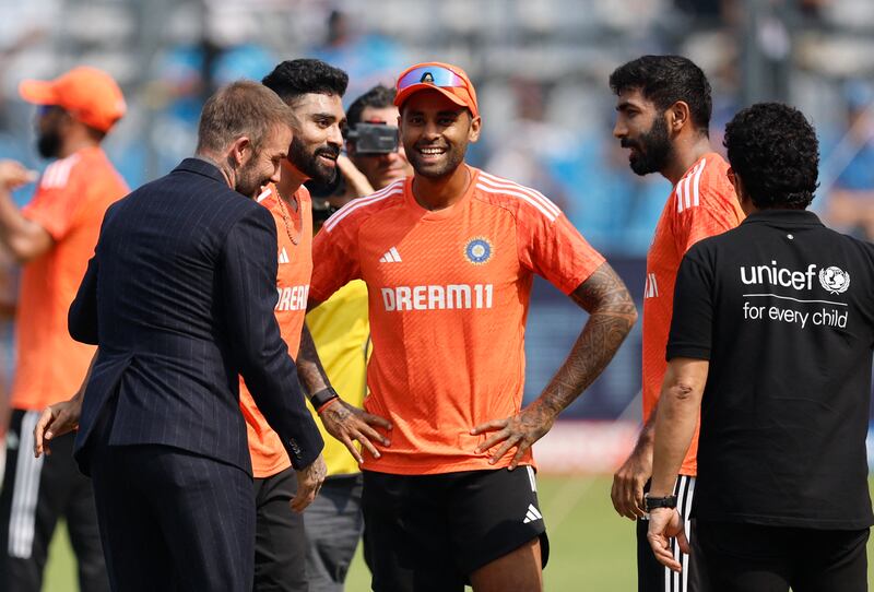 David Beckham and Sachin Tendulkar with India's Mohammed Siraj, Suryakumar Yadav and Jasprit Bumrah. Reuters
