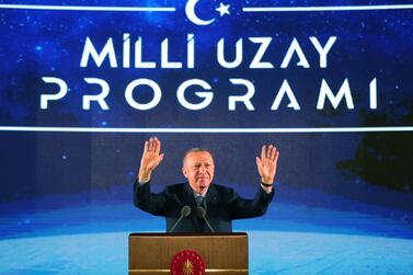 Turkish President Recep Tayyip Erdogan gestures during the National Space Program introductory meeting in Ankara, Turkey, on February 9, 2021. Erdogan said that Turkey's first contact with the Moon will take place in 2023, a Turkish citizen will be sent to space and the establishment of a spaceport is planned. Turkish President Press Office / EPA