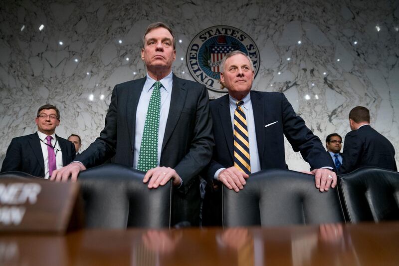Senate Intelligence Chairman Richard Burr, R-N.C., right, and Committee Vice Chairman Mark Warner, D-Va., left, stand following testimony from Homeland Security Secretary Kirstjen Nielsen and former Homeland Security Secretary Jeh Johnson at a Senate Intelligence Committee hearing on election security on Capitol Hill in Washington, Wednesday, March 21, 2018. (AP Photo/Andrew Harnik)