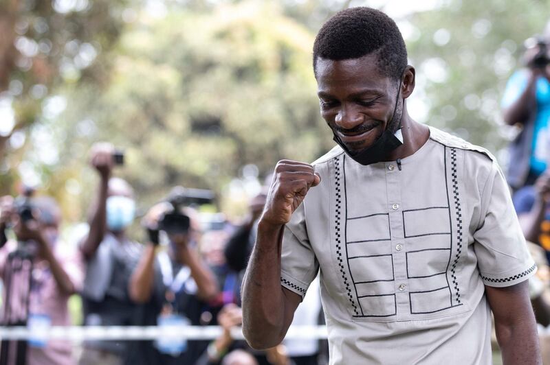 Opposition candidate, Bobi Wine clenches his fist after voting. Getty Images