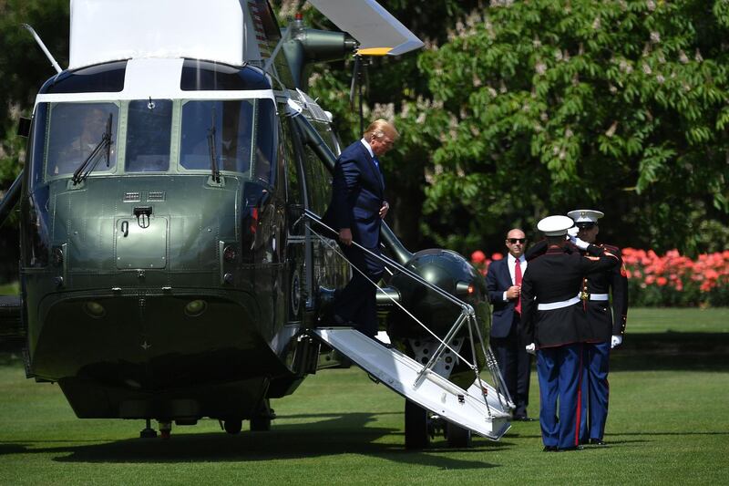 US President Donald Trump steps off Marine One to attend a welcome ceremony at Buckingham Palace in central London on June 3, 2019, on the first day of their three-day State Visit to the UK. Britain rolled out the red carpet for US President Donald Trump on June 3 as he arrived in Britain for a state visit already overshadowed by his outspoken remarks on Brexit.  AFP