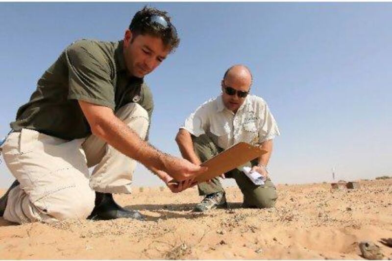 Stephen Bell, left, and Tamer Khafaga, are two of the professional conservationists at Dubai Desert Conservation Reserve. They have welcomed the new eco-initiative as a valuable support to their work. Pawan Singh / The National