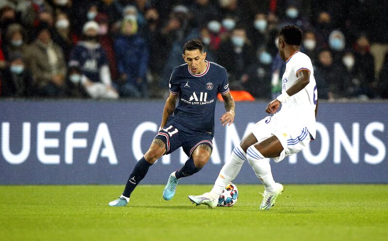 Angel di Maria of PSG takes on Vinicius Junior of Real Madrid. EPA