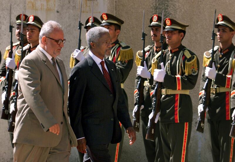 United Nations General Secretary Kofi Annan walks with Palestinian Peace Negotiator Saeb Erekat on his way to meet with Palestinian President Yasser Arafat in Ramallah on June 22, 2000. Reuters