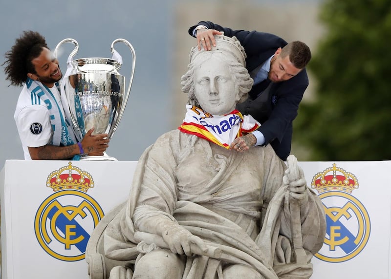 Sergio Ramos and Marcelo celebrate with the Champions League trophy at Cibeles square in Madrid, Spain, 27 May 2018. Javier Lizon / EPA