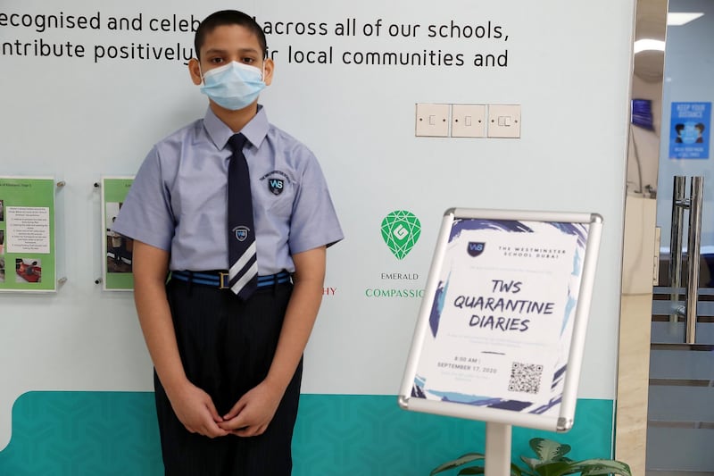 DUBAI, UNITED ARAB EMIRATES , September 21 – 2020 :- Abdullah Kasim student of grade 7 with the Digital Quarantine Diaries ( on the right) of 400 pages which is written by the students of The Westminster School in Al Qusais in Dubai.  (Pawan Singh / The National) For News. Story by Sarwat