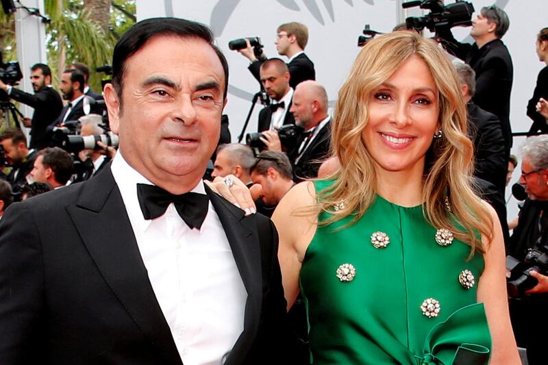 FILE PHOTO: 70th Cannes Film Festival – Screening of the film "L'Amant double" (Amant Double) in competition - Red Carpet Arrivals - Cannes, France. 26/05/2017. Carlos Ghosn, Chairman and CEO of the Renault-Nissan Alliance, and his wife Carole pose. Picture taken May 26, 2017.  REUTERS/Jean-Paul Pelissier/File Photo