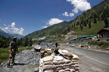 India's Border Security Force (BSF) soldiers stand guard at a checkpoint along a highway leading to Ladakh, at Gagangeer in Kashmir's Ganderbal district. Reuters