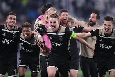 Ajax's Dusan Tadic, David Neres and Matthijs de Ligt celebrate after the match. Reuters