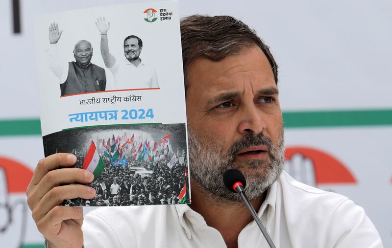 Indian National Congress senior leader Rahul Gandhi with a copy of the party's election manifesto, which it calls a 'document of justice'. EPA