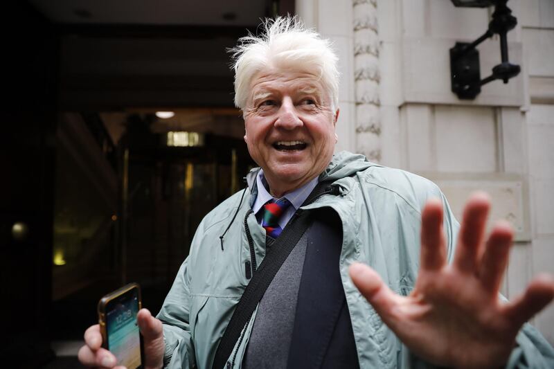 (FILES) In this file photo taken on September 24, 2019 Stanley Johnson, father of Britain's Prime Minister Boris Johnson, leaves the Millbank broadcast studios near the Houses of Parliament in central London.  The father of British Prime Minister Boris Johnson will apply for French nationality after his son led the United Kingdom away from the European Union, reports the Sunday Times on March 22. / AFP / Tolga AKMEN
