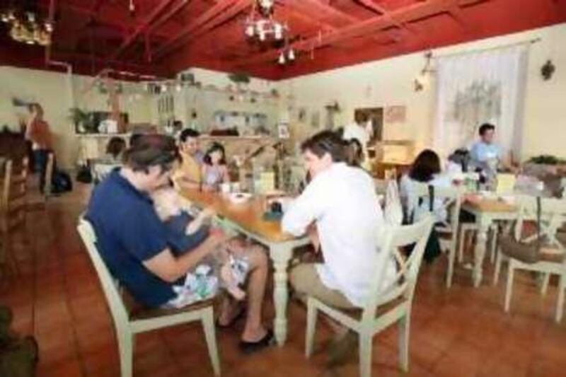 DUBAI, UNITED ARAB EMIRATES - May 16:  Customers enjoy the Friday brunch at the Organic Foods & Cafe in The Greens in Dubai on May 16, 2008. (Randi Sokoloff / The National) *** Local Caption ***  RS003-OrganicBrunch.jpgal21OrganicBrunch2.jpg