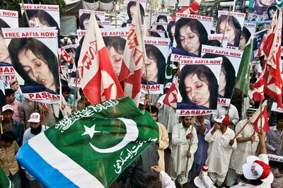 FILE - Protesters rally near the U. S.  consulate in Karachi, Pakistan on Thursday, Sept.  23, 2010, to condemn the arrest of alleged Al-Qaida suspect Aafia Siddiqui.  (AP Photo / Shakil Adil, File)