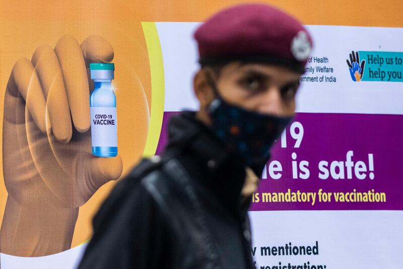 A security guard keeps watch at a Covid-19 vaccination centre New Delhi. AFP