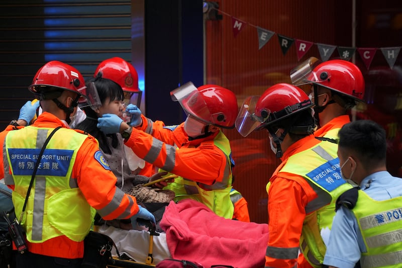 Rescue workers help a victim on a stretcher. Reuters