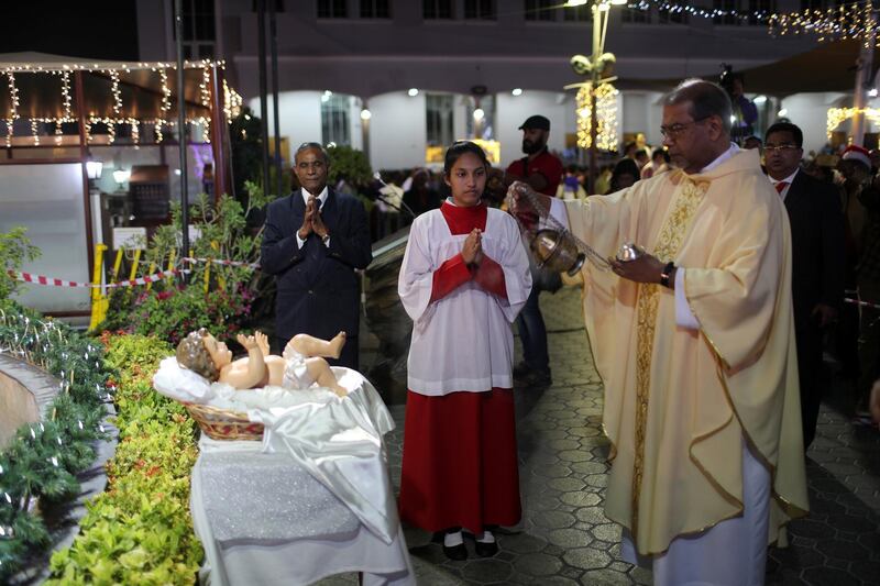 Members of the Christian expatriate community attend a mass on Christmas Eve at Santa Maria Church in Dubai, United Arab Emirates. Reuters