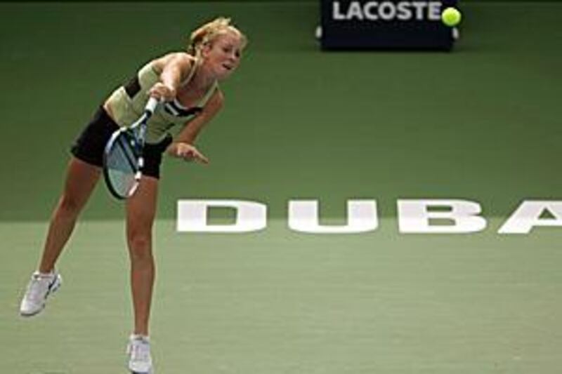 Poland's Urszula Radwanska returns the ball to her sister Agnieszka during their singles match on the second day of the Dubai Championships.