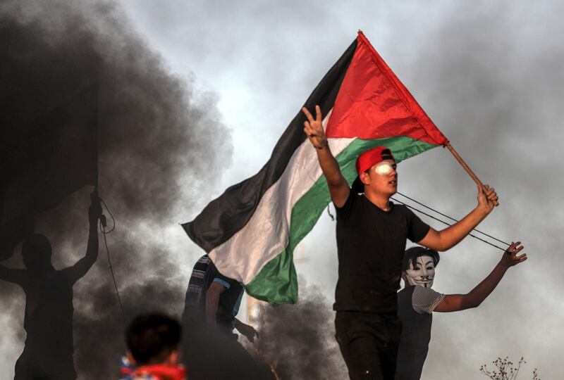 Palestinian protesters during clashes after a protest near the border between Israel and the Gaza Strip. EPA