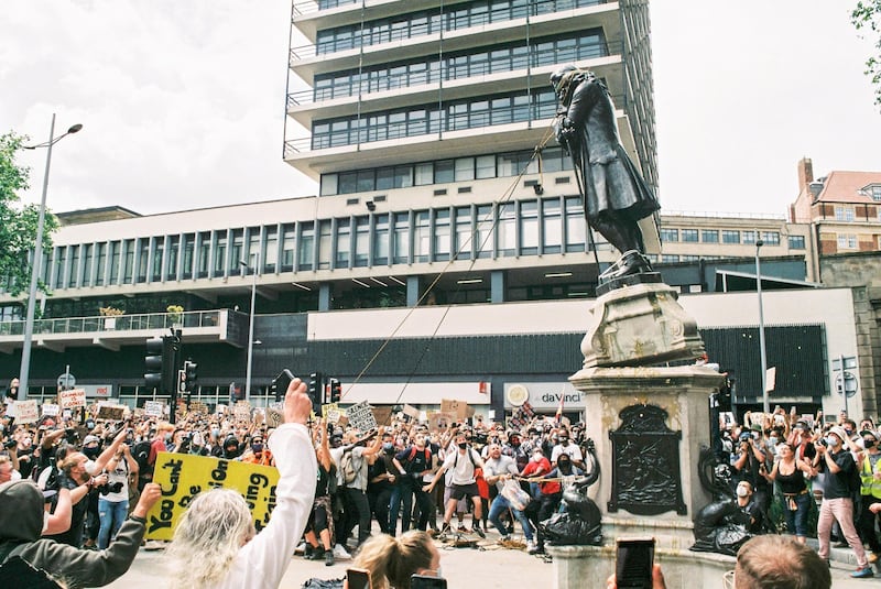 BRISTOL, ENGLAND - JUNE 07: Black Lives Matter protesters toppled the statue of slave owner Sir Edward Colston on June 7, 2020 in Bristol, England.  Bristol wealth and prosperity was built on the slave trade with Colston one of the main benefactors to the city.  (Photo by Harry Pugsley/Getty Images)