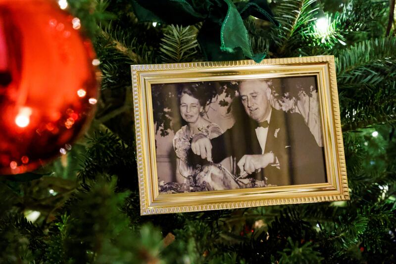 Christmas trees in the State Dining Room are decorated with snapshots of US presidents and their families. This photo shows Franklin and Eleanor Roosevelt. Reuters