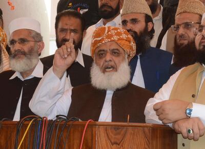 Maulana Fazlur Rehman, head of a Pakistani religious parties alliance, speaks to journalists with other party leaders, in Islamabad, Pakistan, Tuesday, July 31, 2018. Pakistan's political parties say they will join hands against the "stolen mandate" of Imran Khan, whose party won the most votes in an election marred by allegations of fraud. (AP Photo/B.K. Bangash)