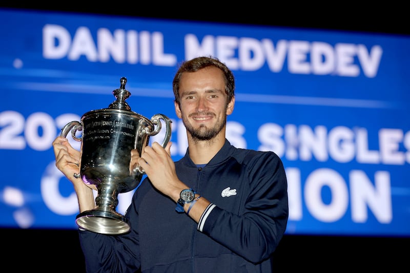Daniil Medvedev of Russia celebrates with the championship trophy after defeating Novak Djokovic of Serbia to win the Men's 2021 US Open final. AFP
