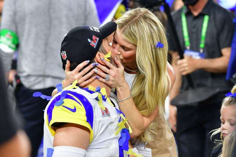 Los Angeles Rams' quarterback Matthew Stafford kisses wife Kelly Hall after winning Super Bowl LVI between the Los Angeles Rams and the Cincinnati Ben. AFP