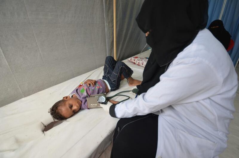 A nurse attends to a boy infected with cholera at a hospital in the Red Sea port city of Hodeidah, Yemen. Abduljabbar Zeyad / Reuters