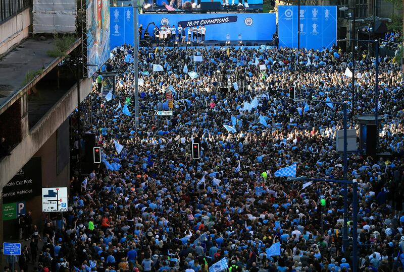 Manchester City players and staff on stage during the trophy parade in Manchester, England, after winning the  FA Cup. Victory for Pep Guardiola’s side came a week after the English Premier League trophy was retained to join the League Cup and Community Shield already in City’s possession. AP Photo