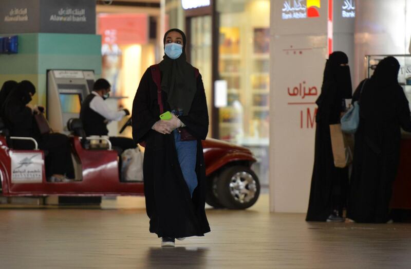 Women shopping at a mall in the Saudi capital Riyadh as they wear face masks.  AFP