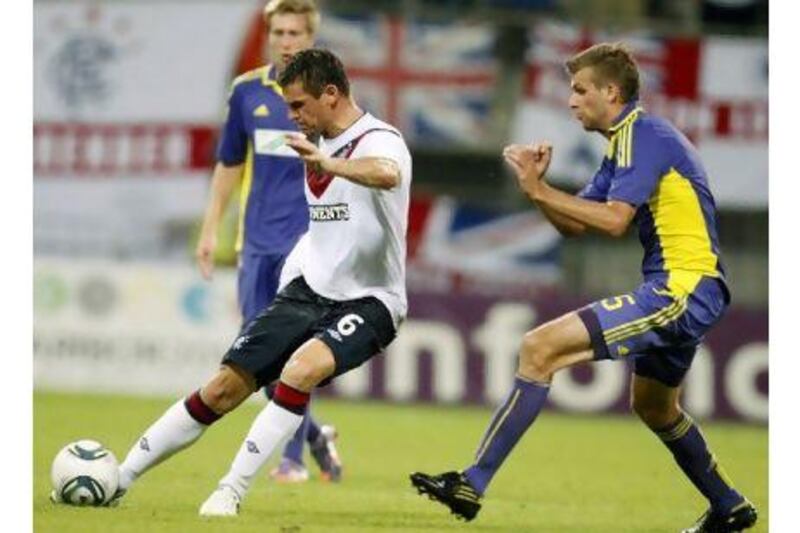 Rangers, the Scottish Premier League champions, lost 2-1 to Maribor in Slovenia in the first leg of their Europa League qualifier.