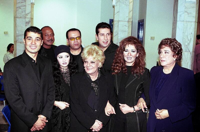 (From L to R) Egyptian actors and singers (From L to R) Khaled al-Nabawy, Talaat Zein, Hanan Turk, Khaled Agag, Nadia Lutfi, Hani Ramzi, Athar al-Hakim and Samiha Ayoub pose for a picture 20 October after performing a song decicated to al-Aqsa uprising and the Palestinian people. (FILM) (Photo by AMR MAHMOUD / AFP)