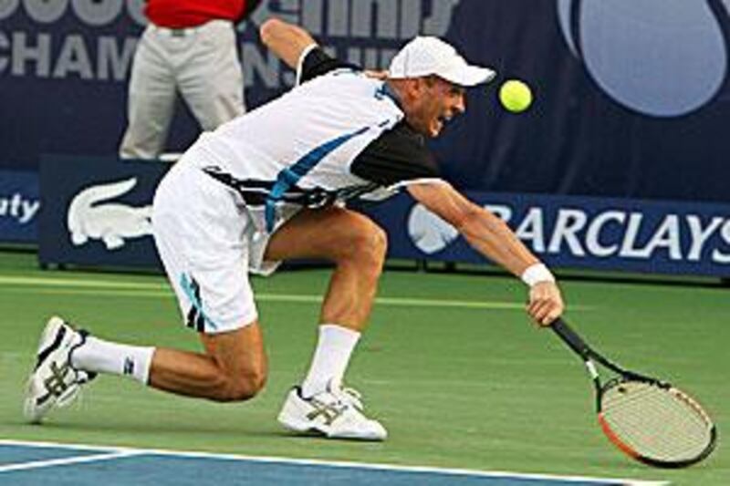 Nikolay Davydenko plays through the pain last night as he beats France's Florent Serra during the first round of the Dubai Tennis Championships.