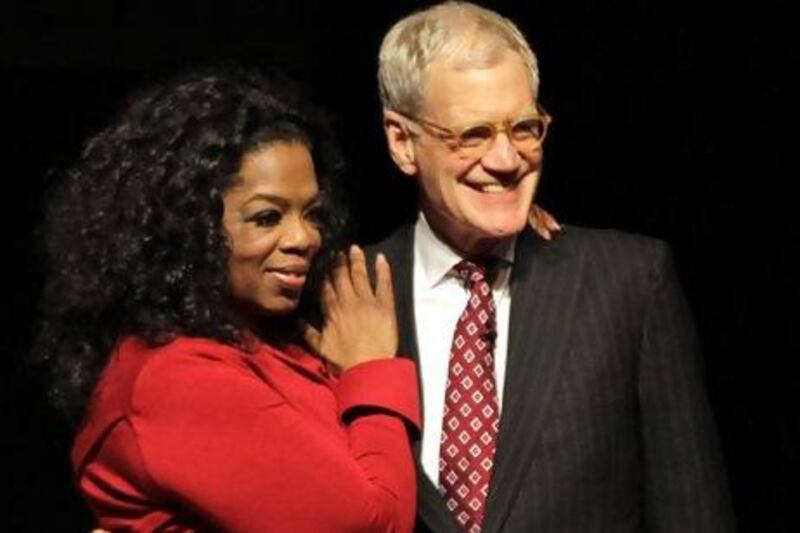 Oprah Winfrey and David Letterman. Michael Conroy / AP Photo