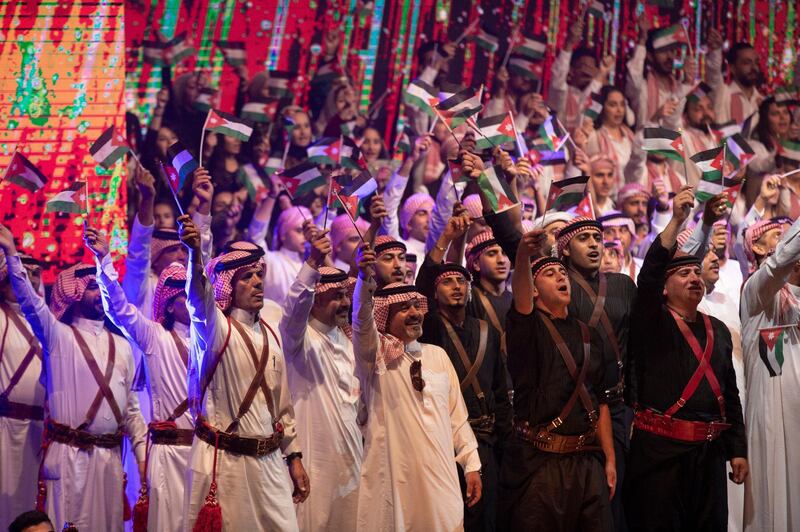 Jordanians cheer at the event. EPA