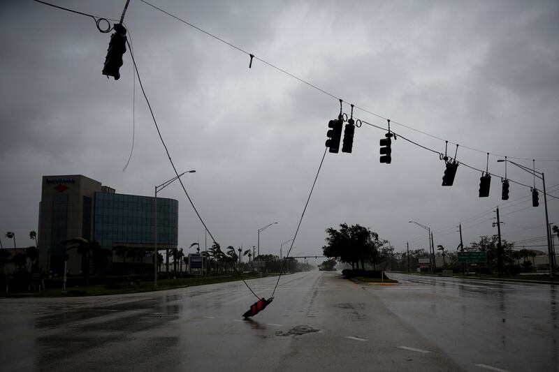 Traffic lights were no match for Hurricane Ian's power in Fort Myers. Reuters